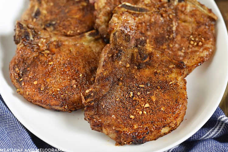 dry rubbed bone-in air fryer pork chops on a platter