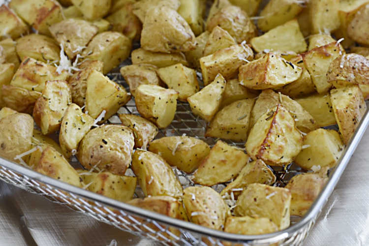 air fried potatoes with parmesan in air fryer basket