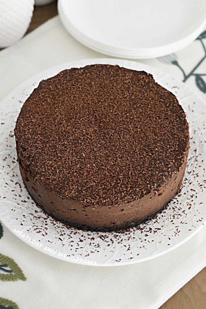 copycat godiva chocolate cheesecake on a white plate