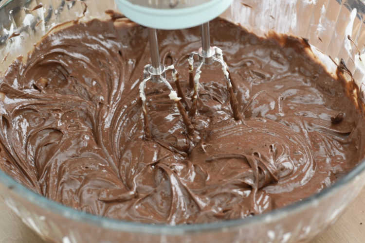 mix chocolate cheesecake batter with electric mixer