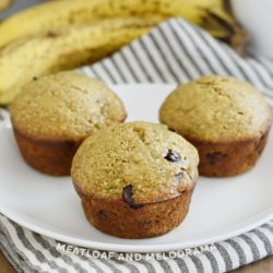 banana applesauce muffins with chocolate chips on a white plate