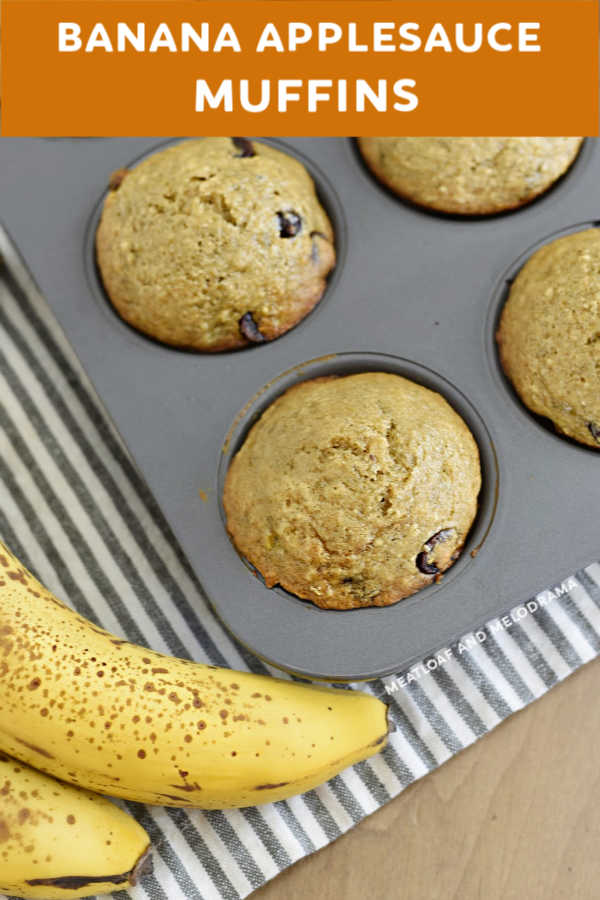 banana applesauce muffins in muffin tin next to bananas