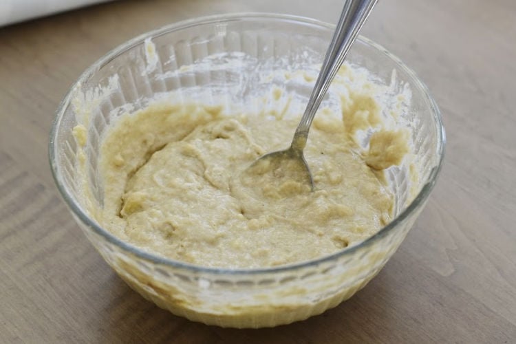 mix banana muffin batter in mixing bowl