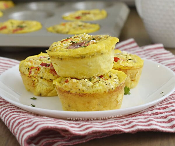 ham and egg muffins with peppers and cheese on a plate