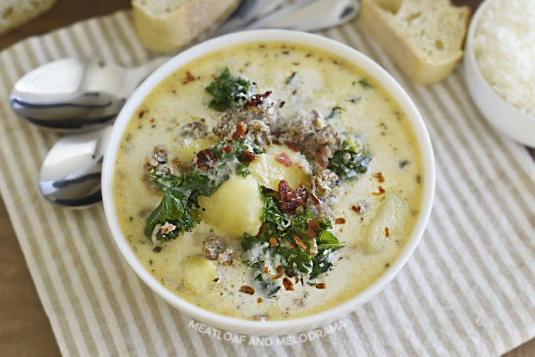 bowl of instant pot zuppa toscana with bacon and parmesan cheese