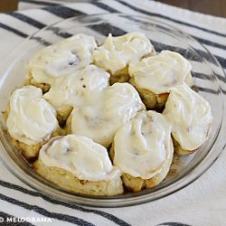 cinnamon rolls made from 2 ingredient dough with cream cheese frosting in a pie pan