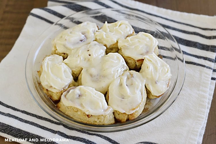 cinnamon rolls made from 2 ingredient dough with cream cheese frosting in a pie pan
