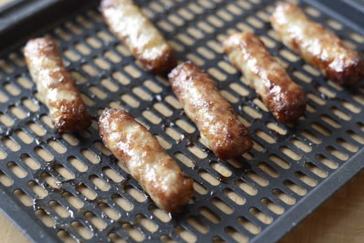 cooked breakfast sausage links on vortex tray