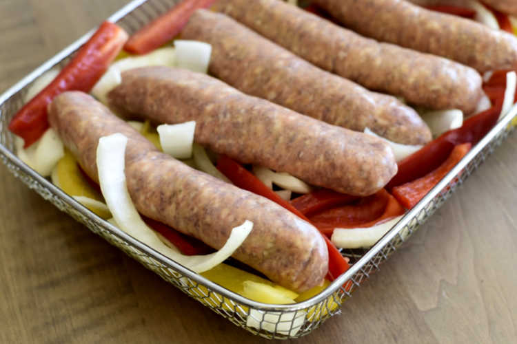 Italian sausage links with sliced onions and bell peppers in omni plus basket