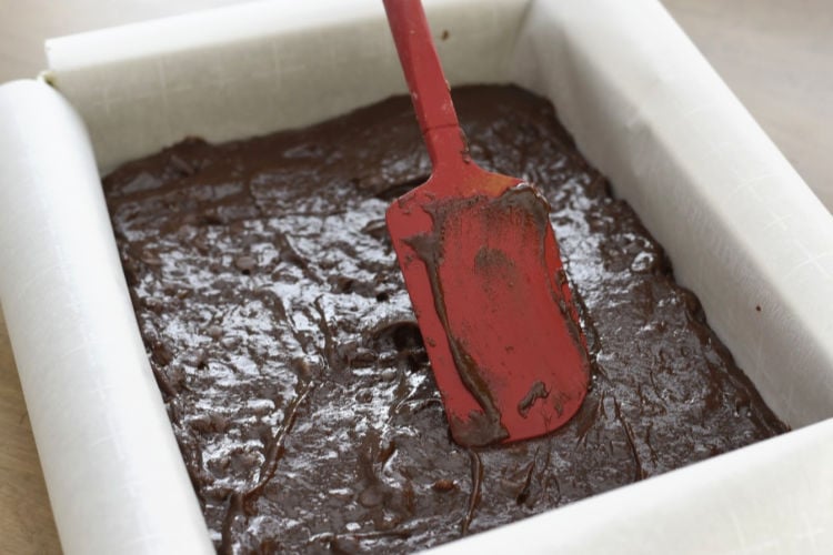 spread brownie batter in baking pan