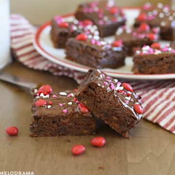 ancho chili brownies with cinnamon imperial candy topping on a red and white plate