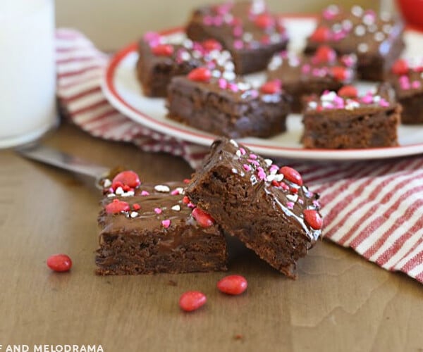 ancho chili brownies with cinnamon imperial candy topping on a red and white plate