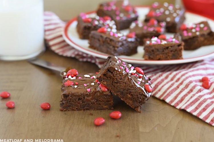 ancho chili brownies with cinnamon imperial candy on a red and white plate