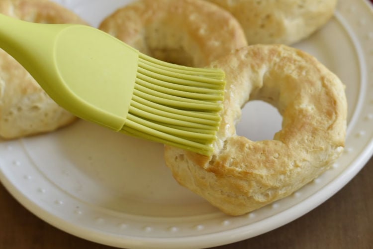 brush donuts with melted butter