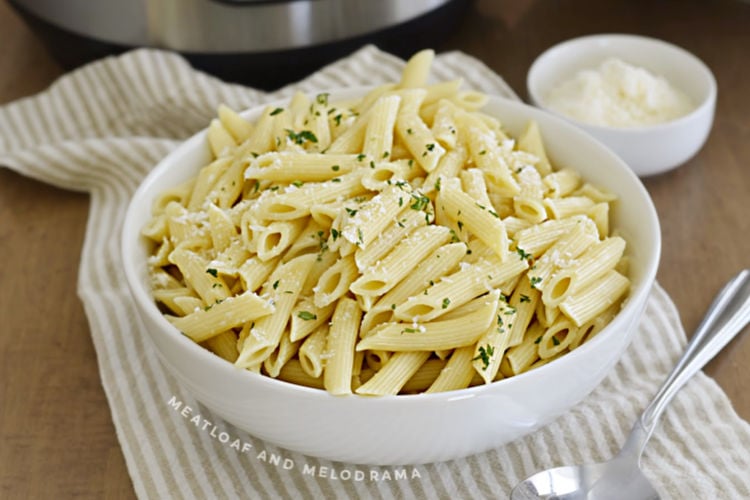 bowl of penne pasta with parmesan cheese