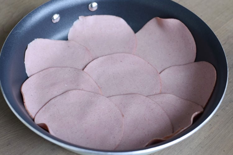 sliced bologna in frying pan