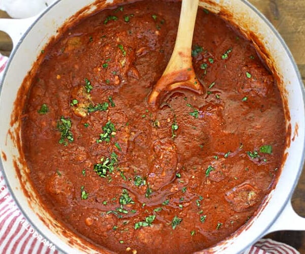 homemade spaghetti sauce in a dutch oven with parsley