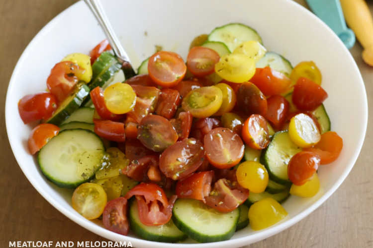 mix dressing with sliced tomatoes and cucumbers