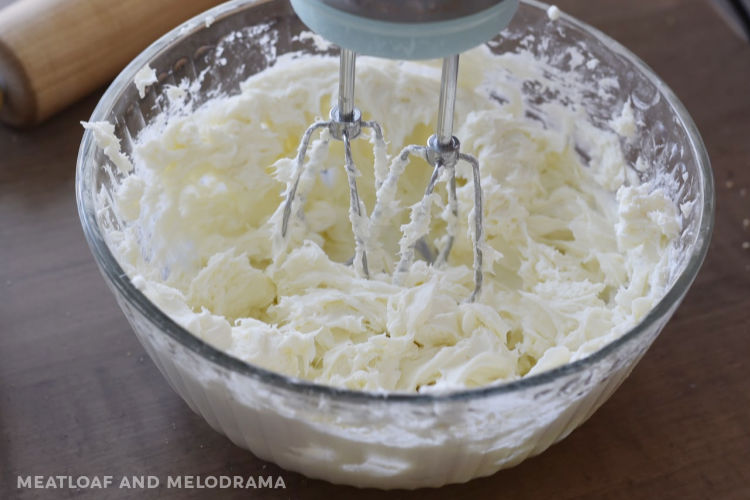 beat cream cheese and sugar with electric mixture in mixing bowl