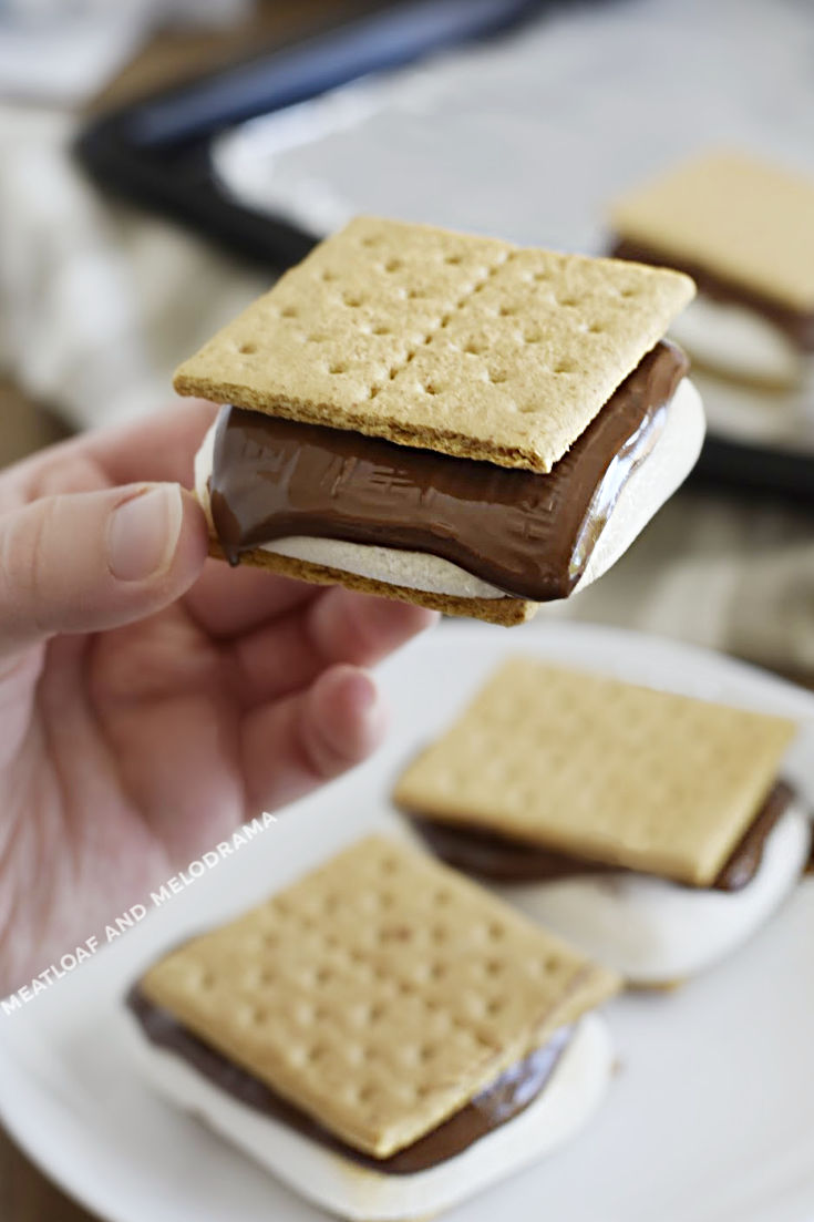 s'mores with melting chocolate in hand