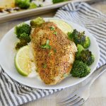 baked honey lime chicken with broccoli and rice on a plate