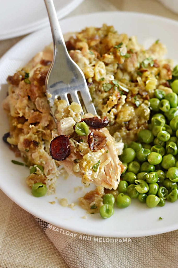 chicken stuffing bake on a fork with peas