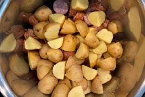 cut up potatoes over smoked sausage in the instant pot