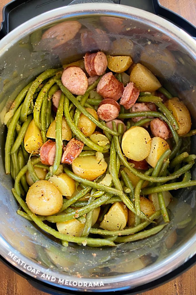 smoked polish sausage with cut potatoes and green beans in the pressure cooker
