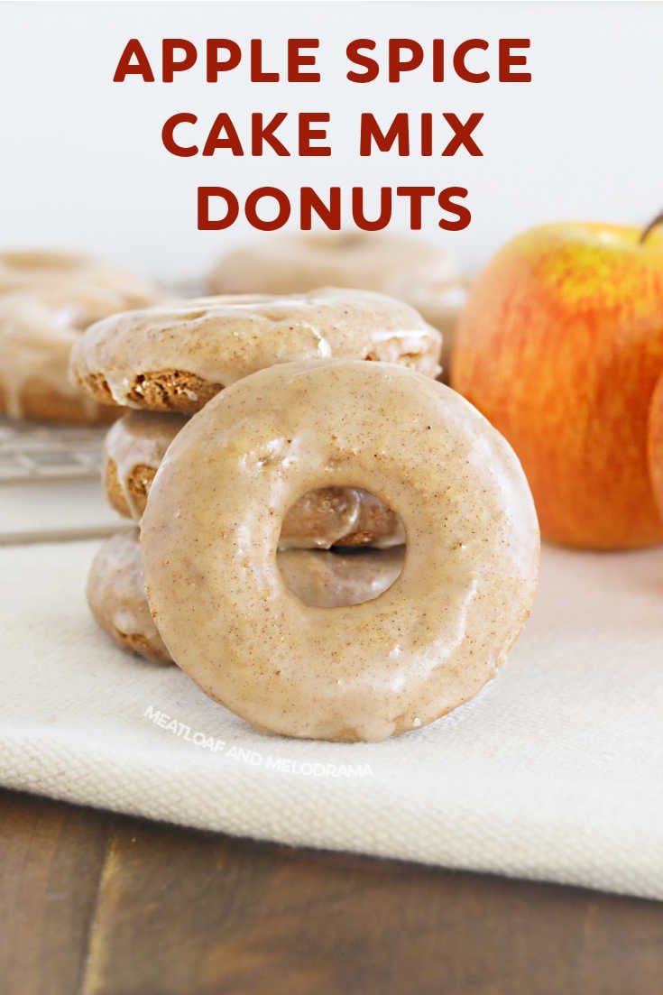Baked Apple Spice Cake Donuts made with cake mix and applesauce and topped with a sweet apple cider glaze are easy to make. This 2 ingredient donut recipe is perfect for fall breakfast! via @meamel