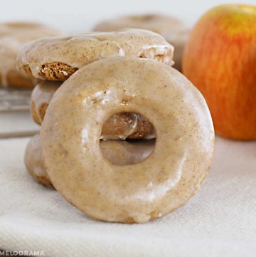 glazed apple spice cake donut with apples on the table