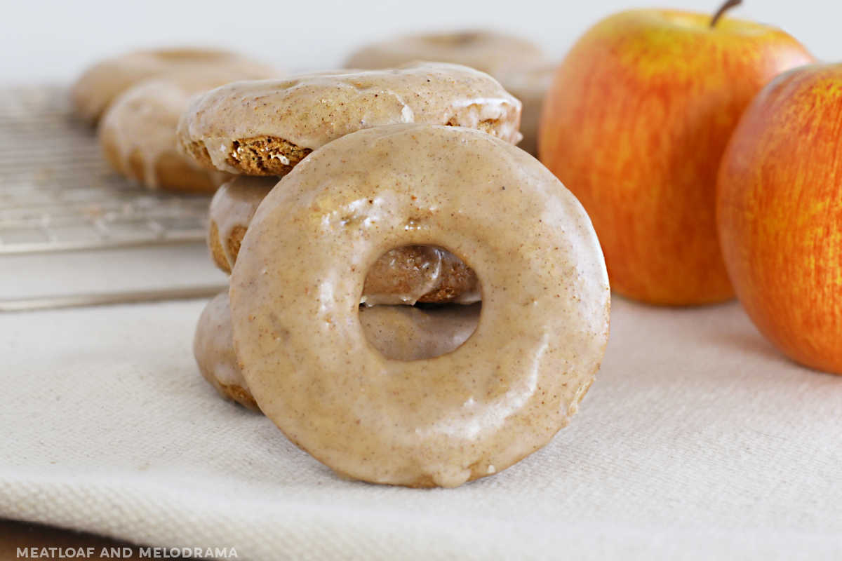 glazed apple spice cake donut with apples on the table