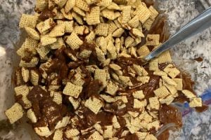 stir rice chex cereal into chocolate peanut butter mixture