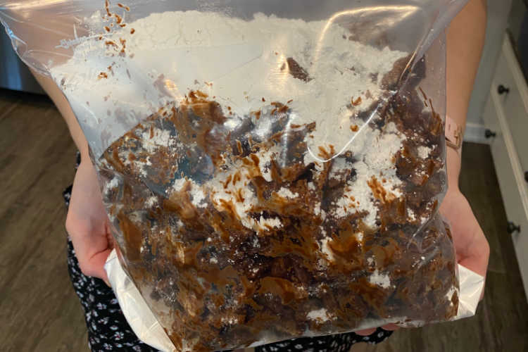 chex cereal with chocolate and powdered sugar in large freezer bag