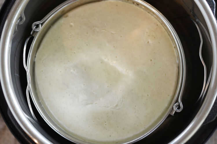 cheesecake in push pan with handles inside pressure cooker