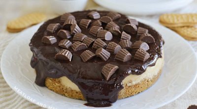 Instant Pot peanut butter cheesecake with chocolate ganache and peanut butter cups on top