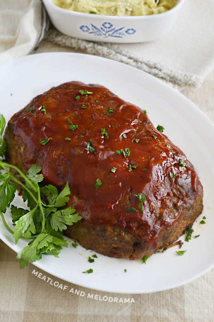 meatloaf with onion soup mix and ketchup glaze on a white platter