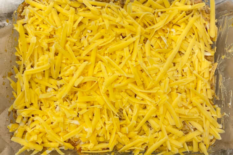 shredded cheddar and colby jack cheese in casserole dish