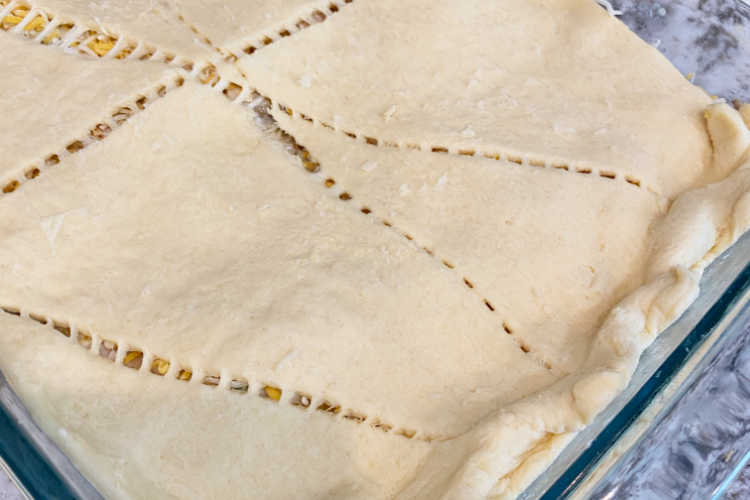 roll of crescent dough on casserole