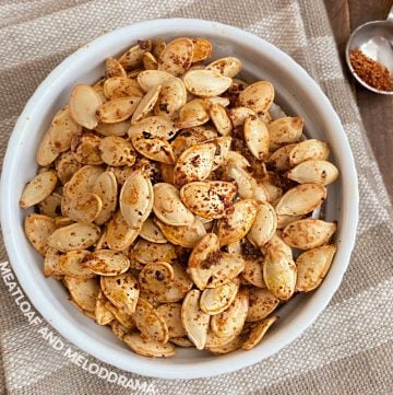 spicy roasted pumpkin seeds with taco seasoning in a white bowl