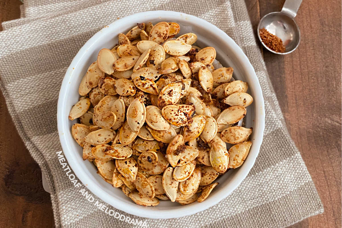 spicy roasted pumpkin seeds with taco seasoning in a white bowl