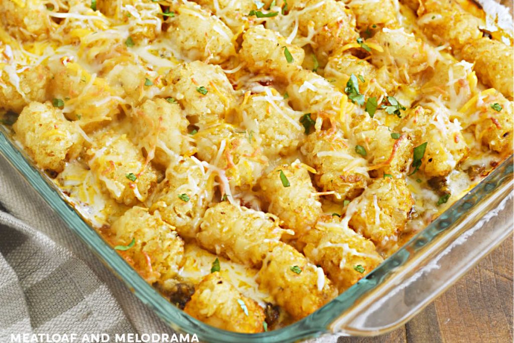 taco tater tot casserole with cilantro in a baking dish