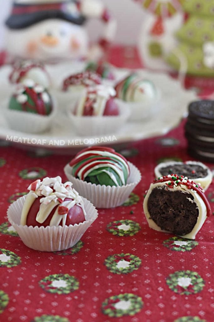 holiday truffles made from Oreo cookies dipped into red and green candy melts on the table