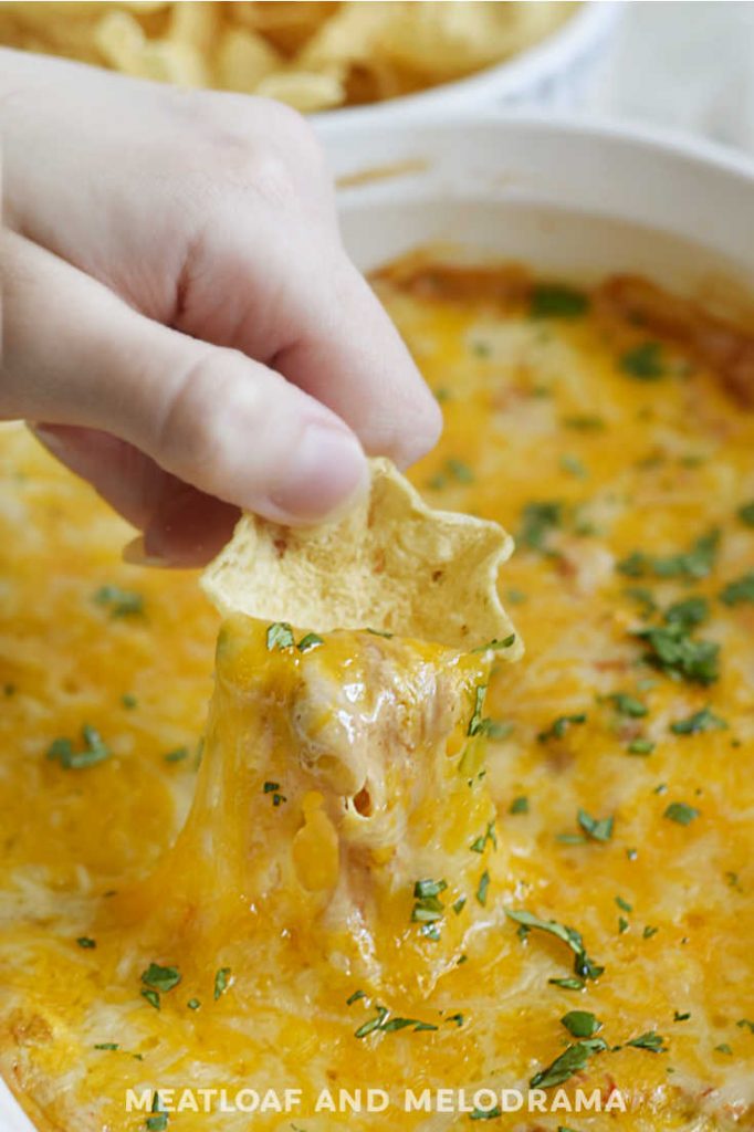 cheesy hot dip on tortilla chip
