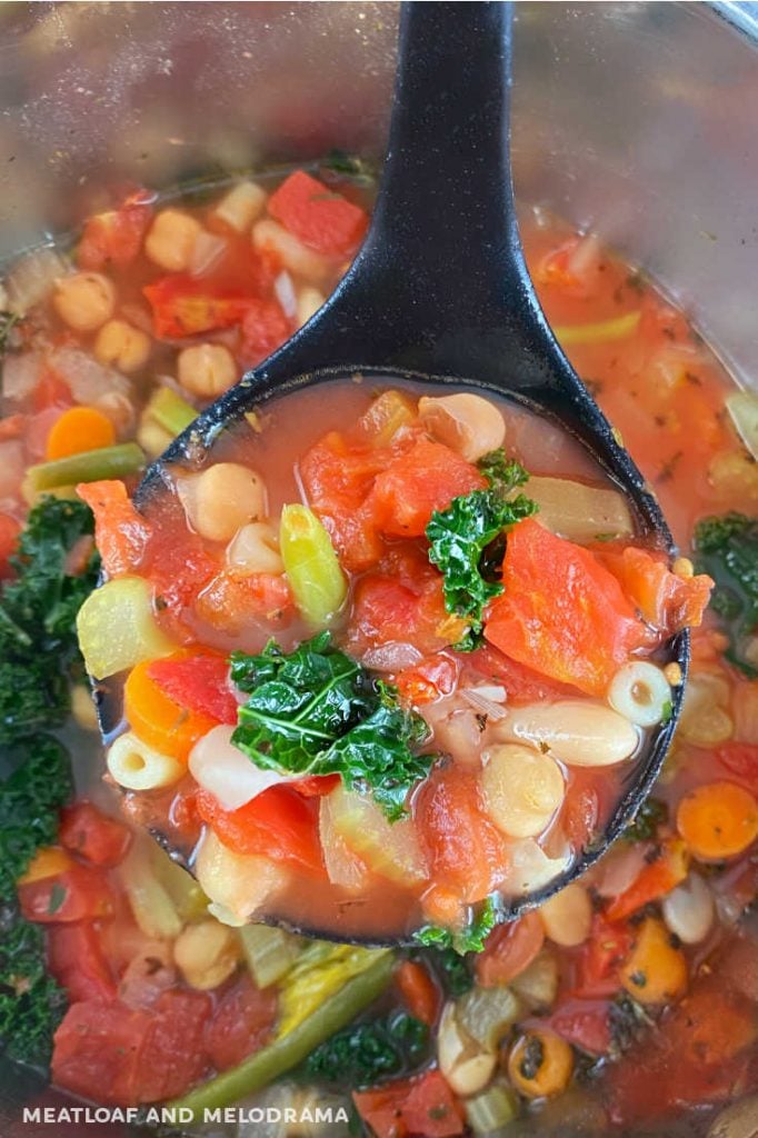minestrone soup on a ladle in pressure cooker