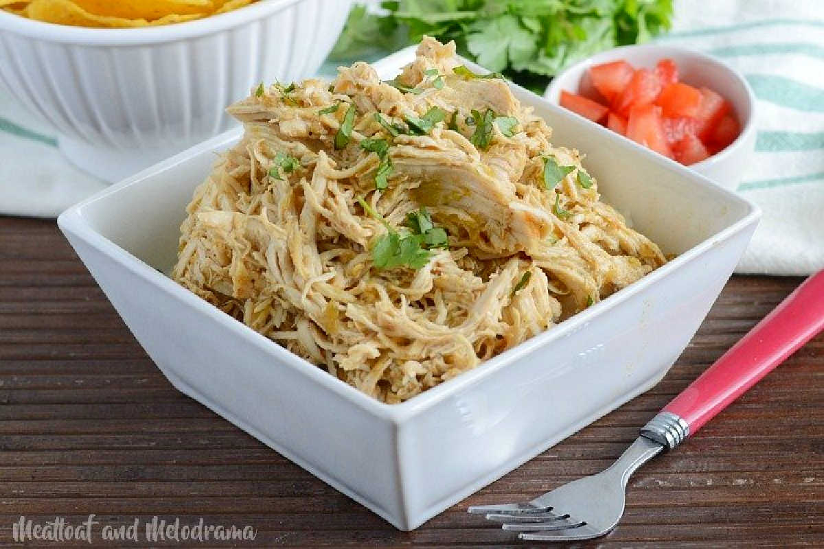 instant pot salsa verde chicken with cilantro in a bowl