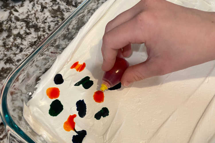 add drops of food coloring to cool whip