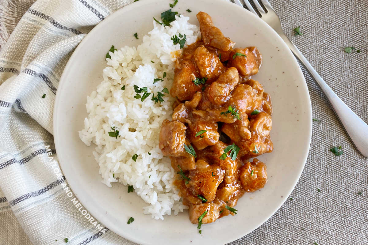 plate of bourbon chicken and jasmine rice on the table 