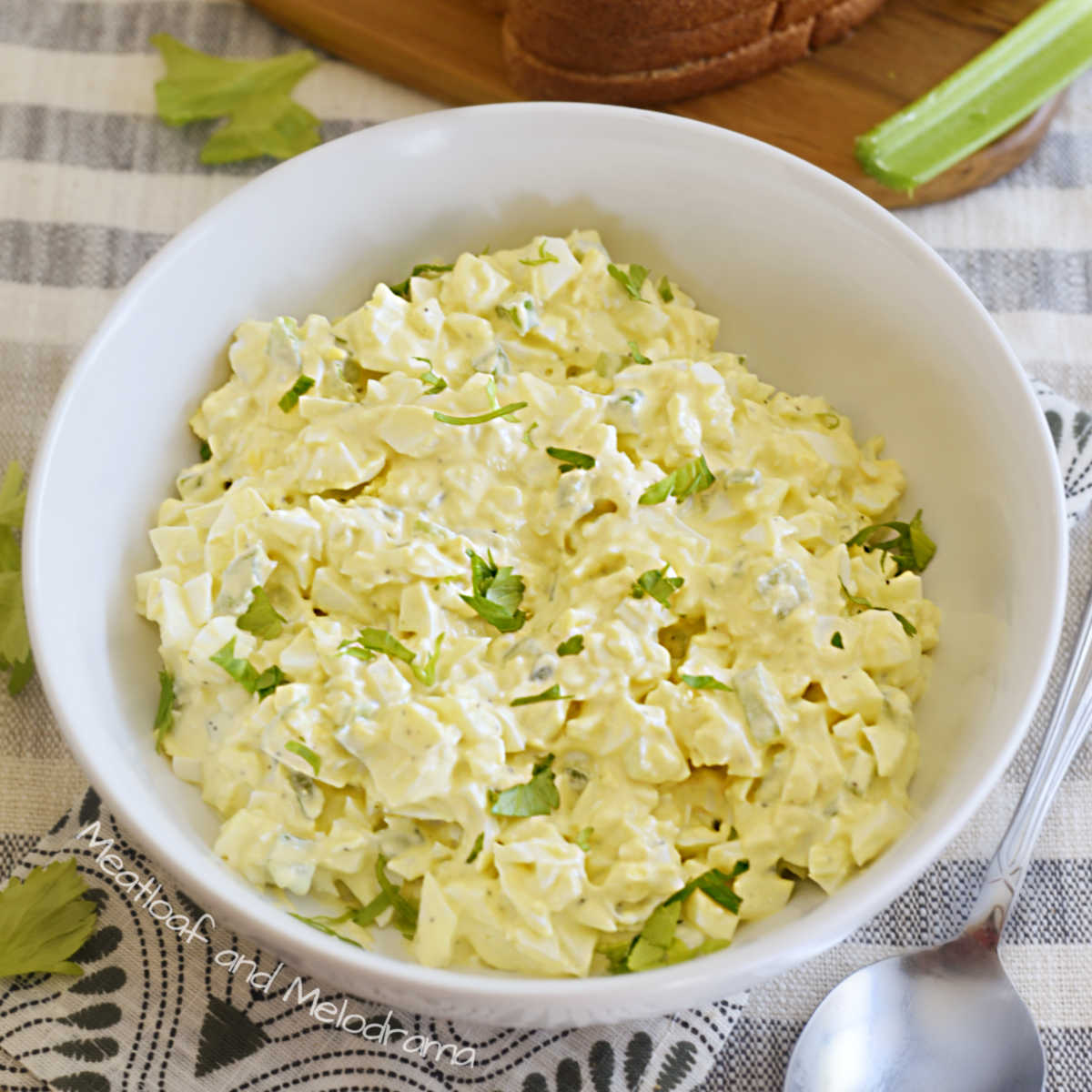 simple egg salad with celery in a white bowl