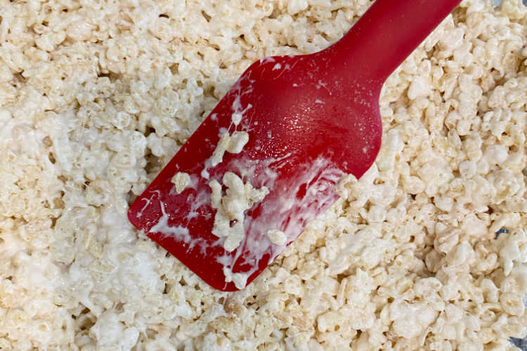 spread marshmallow coated cereal into baking pan