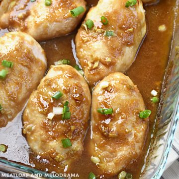 baked honey garlic chicken breasts with green onions in baking dish